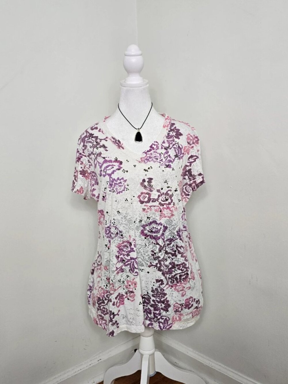White short sleeve v neck top with all over purple and pink floral print